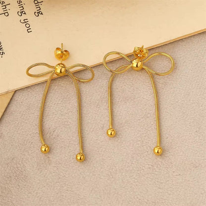 Bead Adorned Bow Earrings
