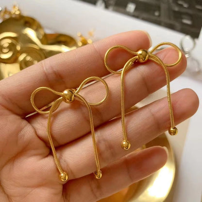Bead Adorned Bow Earrings